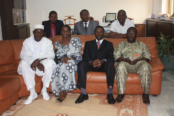 Group photo of AACB’s Executive Secretariat staff with recipients. First range: Mr Boubacar Mane (Mrs Mane’s husband) , Mrs Marie-Therese Mane (recipient), AACB’s Executive Secretary Mr Samuel Meango and Mr Albert Bah (recipient) Second range: Mr Arthur Koffi (Webmaster), Mr Dakitse-Benissan (Research Officer) and Mr Mamadou Seye (Archivist)