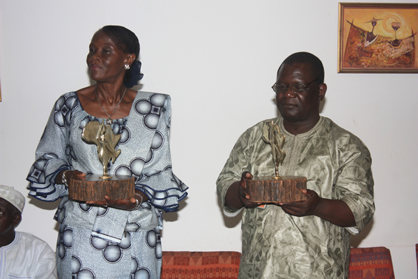 The recipients holding their gifts